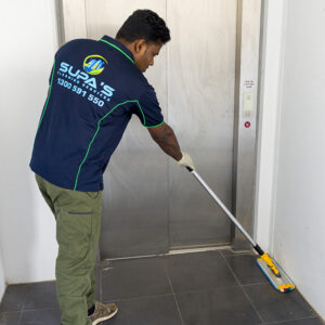Mopping floors within interior office building